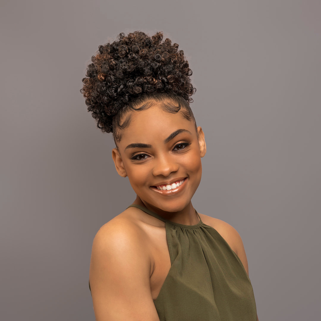 Beautiful young black woman smiling with white teeth